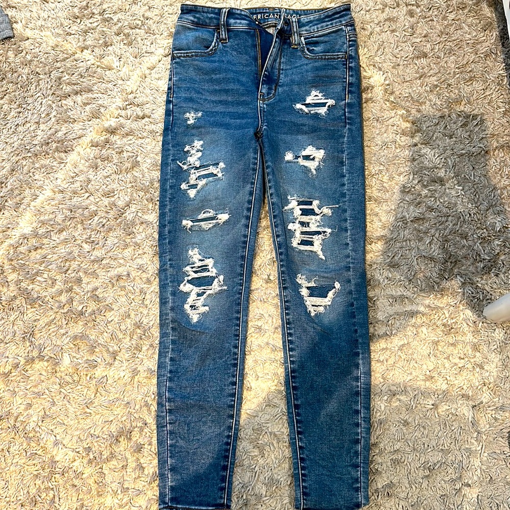 Dark blue jeans rips with patches